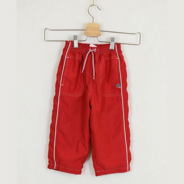 Červené šusťákové kalhoty, vel. 92